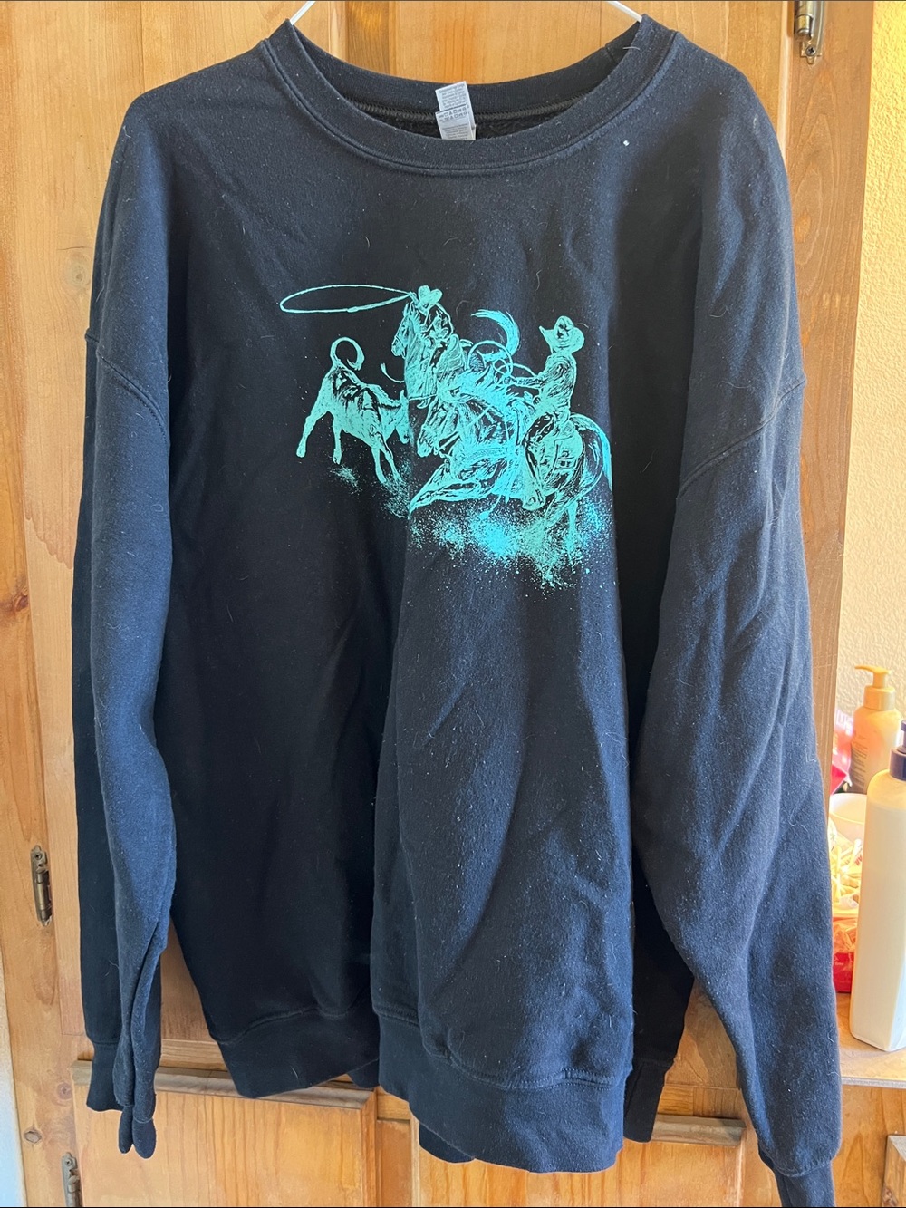Gildan Black Crewneck Sweatshirt with Teal Rodeo Graphic